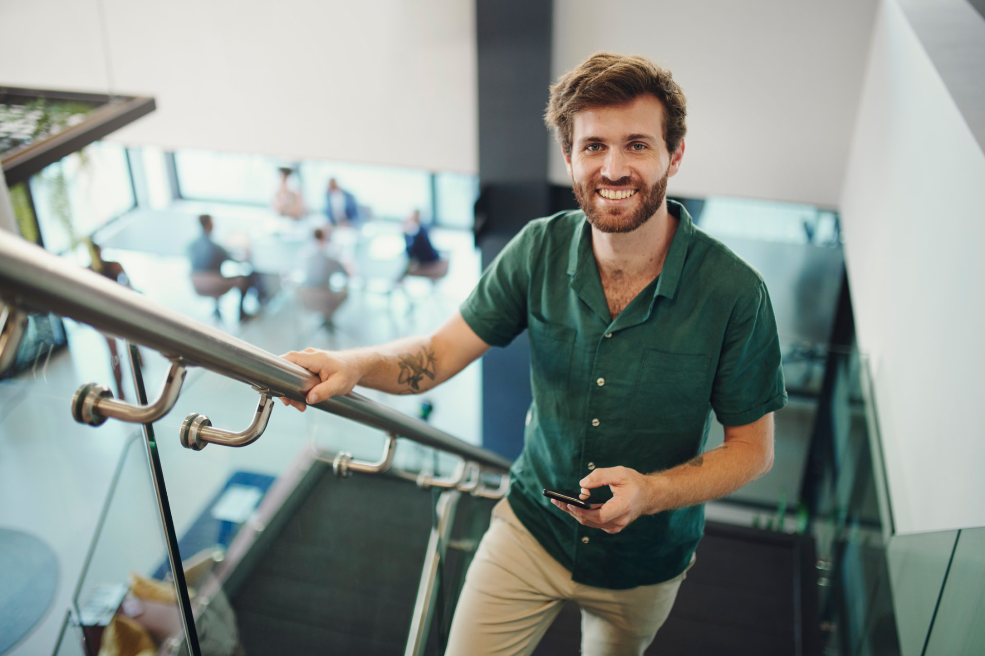 Business professional walking down an office staircase